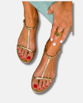 Sandalias planas metálicas con tira en T